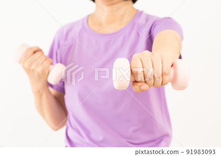 Middle woman doing muscle training with dumbbells 91983093