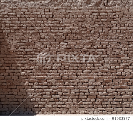 Texture of an old wall made with stone bricks of sandstone in Egypt Texture of an old wall made with stone bricks of sandstone in Egypt 91983577