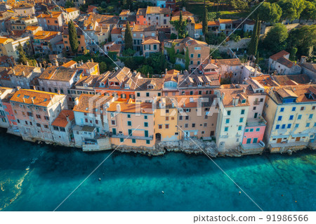 Aerial view of beautiful old houses with orange roofs at sunset 91986566