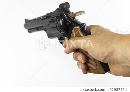 A man's hand with a toy gun (Japanese, 30s, no face) A man's hand with a toy gun (Japanese, 30s, no face) 91987234
