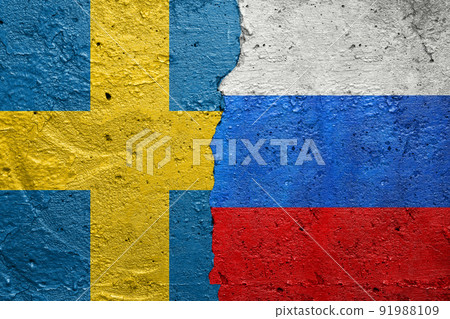 Sweden vs Russia - Cracked concrete wall painted with a Swedish flag on the left and a Russian flag on the right stock photo 91988109