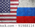 United States of America vs Russia - Cracked concrete wall painted with a USA Americas flag on the left and a Russian flag on the right stock photo 91988114