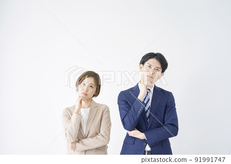 Thinking business woman and businessman white background Thinking business woman and businessman white background 91991747
