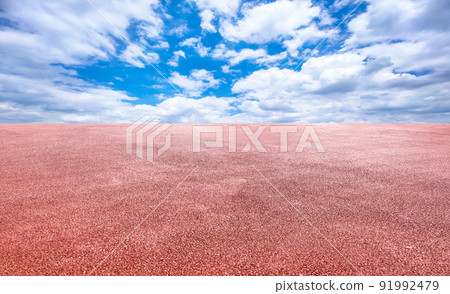 Dark red asphalt road with clear cloudy sky Dark red asphalt road with clear cloudy sky 91992479