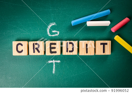 Get Credit. Wooden alphabet letters and pieces of chalk on a green chalk board Get Credit. Wooden alphabet letters and pieces of chalk on a green chalk board 91996052