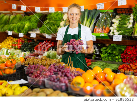 Teenage girl working in grocery as job experience Teenage girl working in grocery as job experience 91996538
