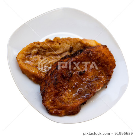 Fried bread with milk, egg and sugar. Typical Spanish Easter sweet Fried bread with milk, egg and sugar. Typical Spanish Easter sweet 91996689