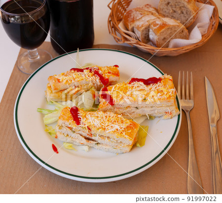 Pastel de verano - delicious summer cake with sliced bread, ham, cheese, surimi, mayonnaise Pastel de verano - delicious summer cake with sliced bread, ham, cheese, surimi, mayonnaise 91997022