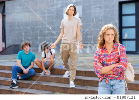 Sad girl quarreled with boys Sad girl quarreled with boys 91997121