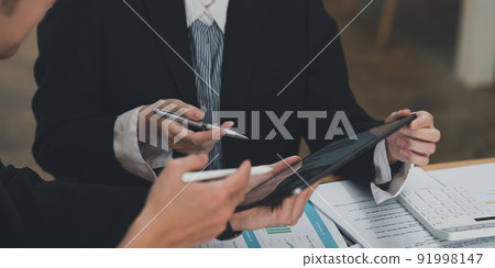 Group of Business planning business strategy and brainstorming to analyze direction global economy. Finance concept. Group of Business planning business strategy and brainstorming to analyze direction global economy. Finance concept. 91998147
