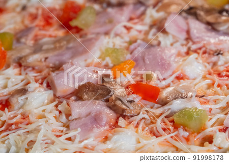 Uncooked homemade pizza in electric oven: close up 91998178