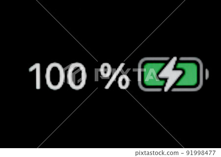Smartphone charged battery level indicator - 100 percent: close up macro 91998477