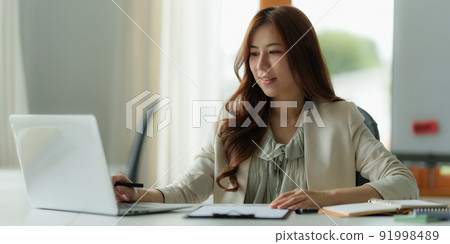 Image of Young business person working online on laptop computer. studying or working from home online concept. 91998489