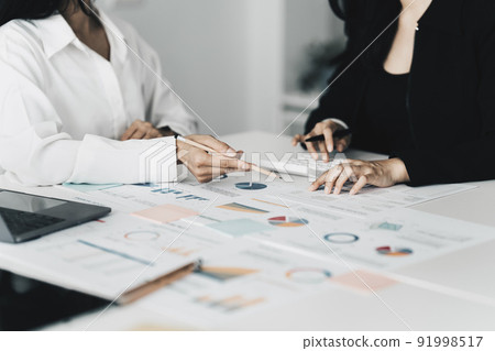 Group of Business woman and Accountant checking data document for investigation of corruption account. Anti Bribery concept. Group of Business woman and Accountant checking data document for investigation of corruption account. Anti Bribery concept. 91998517