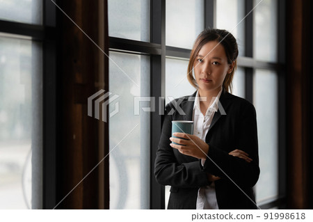 Modern Asian Business woman have confident working with financial team by video conference at office. Accounting concept. Modern Asian Business woman have confident working with financial team by video conference at office. Accounting concept. 91998618