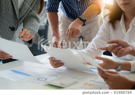 Group of business people working at workplace. Business team hands at working with financial plan, meeting, discussion, brainstorm with tablet on office desk. Group of business people working at workplace. Business team hands at working with financial plan, meeting, discussion, brainstorm with tablet on office desk. 91998784