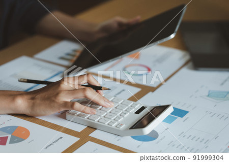 Asian Accountant checking tax and using calculator. Anti Bribery concept. 91999304
