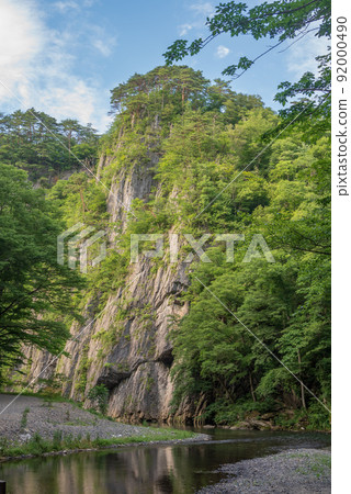 The cliff of Geibikei like a folding screen that rises against the blue sky The cliff of Geibikei like a folding screen that rises against the blue sky 92000490