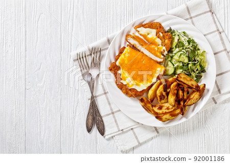 chicken parmo with coleslaw and roast potatoes chicken parmo with coleslaw and roast potatoes 92001186
