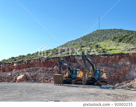 Bulldozers on caterpillars stand near the quarry Bulldozers on caterpillars stand near the quarry 92003255