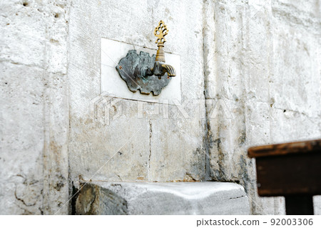 Water tap for washing hands and feet before the prayer in ablution faucets in Mosque in Istanbul 92003306