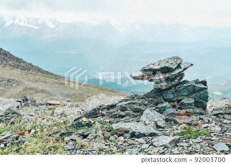 Dramatic panoramic landscape of rocky mountains among storm clouds 92003700