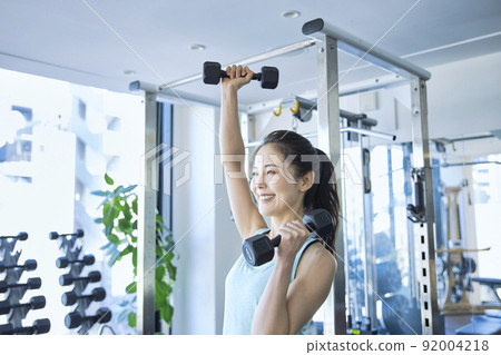 Young woman training in the gym Young woman training in the gym 92004218