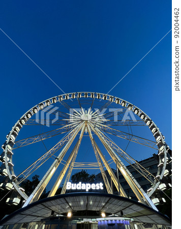 Big ferris wheel against the background of the evening sky. Caption: Budapest Big ferris wheel against the background of the evening sky. Caption: Budapest 92004462