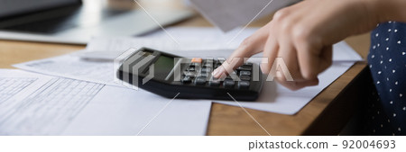Accounting professional woman counting money, expenses, fees Accounting professional woman counting money, expenses, fees 92004693