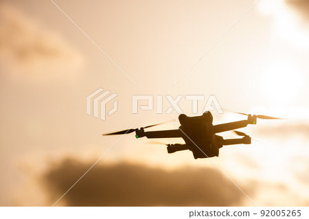 Drone flying in the sunset 92005265