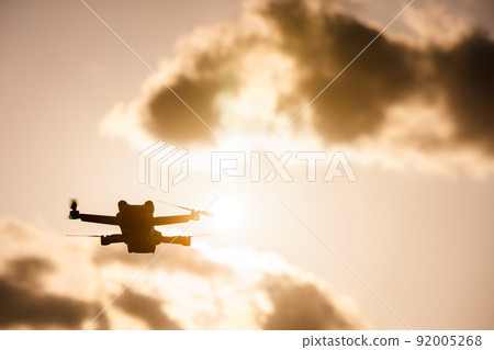 Drone flying in the sunset Drone flying in the sunset 92005268
