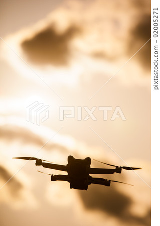 Drone flying in the sunset Drone flying in the sunset 92005271