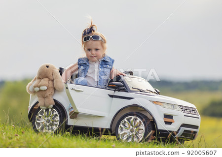 small child stands near his car small child stands near his car 92005607