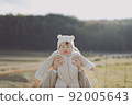 Have fun hugging your child at sunset 92005643