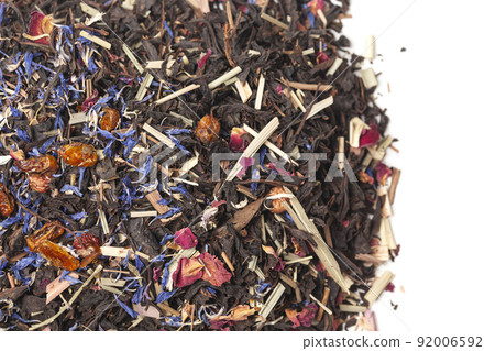 black tea with lemongrass, currant berries, sea buckthorn berries, rose petals, cornflower petals isolated on white background 92006592