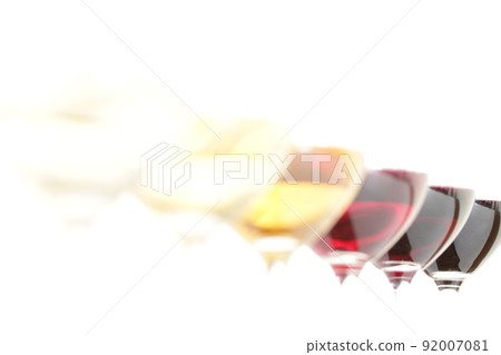 A close-up of an elegant glass filled with delicious white wine (after color correction). A close-up of an elegant glass filled with delicious white wine (after color correction). 92007081