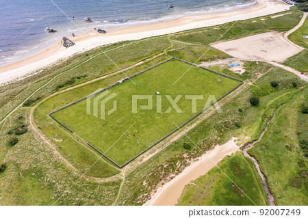 Aerial view of the Killybegs GAA pitch at Fintra beach by Killybegs, County Donegal, Ireland Aerial view of the Killybegs GAA pitch at Fintra beach by Killybegs, County Donegal, Ireland 92007249