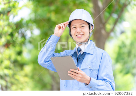 Men in work clothes green back 92007382