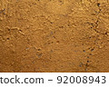 Gold concrete wall background 92008943