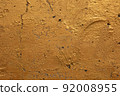 Gold concrete wall background 92008955