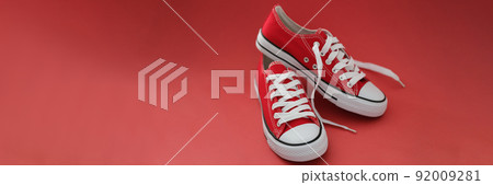 Pair of modern stylish red sneaker shoes, white and red colours mix, new collection Pair of modern stylish red sneaker shoes, white and red colours mix, new collection 92009281