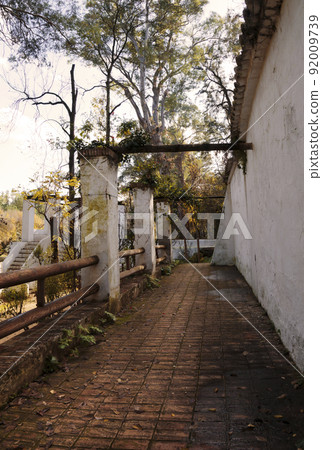 Evocative autumnal scene of a weathered old porch 92009739