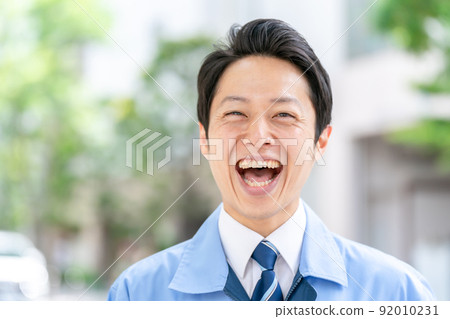 Men in work clothes, fresh green portrait 92010231