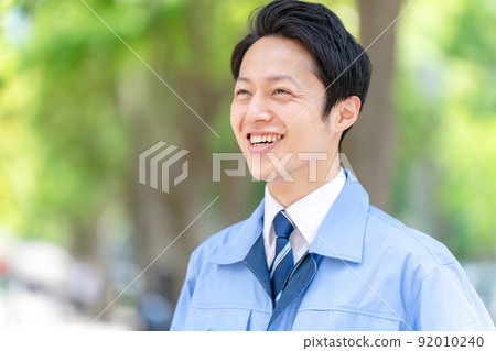 Men in work clothes, fresh green portrait 92010240