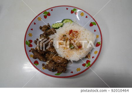 White sesame pork fried rice, arranged in a plate White sesame pork fried rice, arranged in a plate 92010464