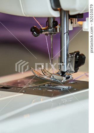 Sewing machine foot. Close-up, selective focus 92010879