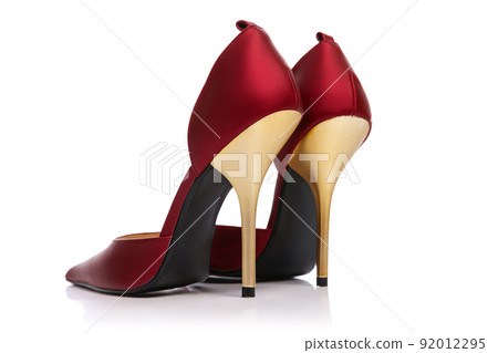Woman's vintage style footwear. Red high-heeled shoes isolated on white background. Concept of art, ad , 60s, 70s retro style fashion. Timeless classic 92012295