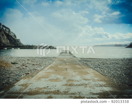 Embankment that extends straight to the sea Embankment that extends straight to the sea 92013338