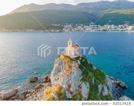 Sveta Nedelja is an islet on the Adriatic Sea, in Montenegrin municipality of Budva. It is located opposite the town of Petrovac na Moru in Montenegro. It has a small church on it 92013428
