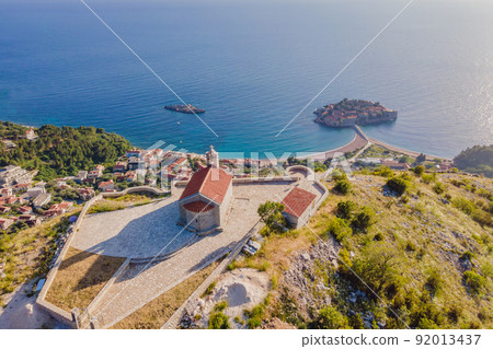 The Church of St. Sava in Montenegro, near the island of Sveti Stefan near Budwa. Drone view. Location: church St. Sava, Montenegro, Balkans, Adriatic sea, Europe The Church of St. Sava in Montenegro, near the island of Sveti Stefan near Budwa. Drone view. Location: church St. Sava, Montenegro, Balkans, Adriatic sea, Europe 92013437